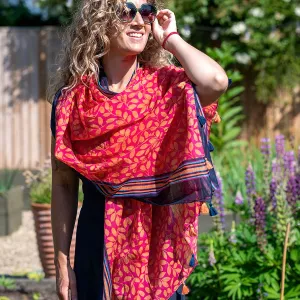 Red and orange leaf print cotton scarf with stripes and tassels